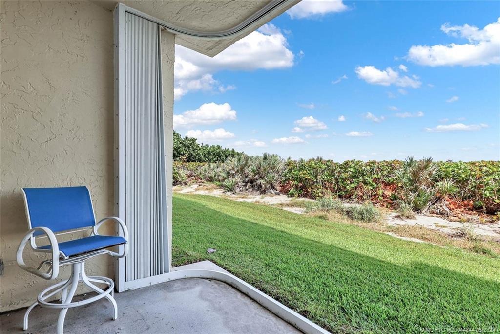 7400 South Ocean Drive, Unit 102 Jensen Beach, FL 34957 - Photo 3 of 26 a view of a yard from a window