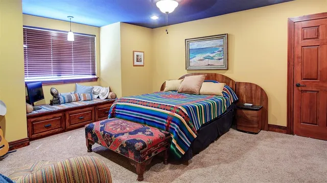 a bedroom with a bed and window