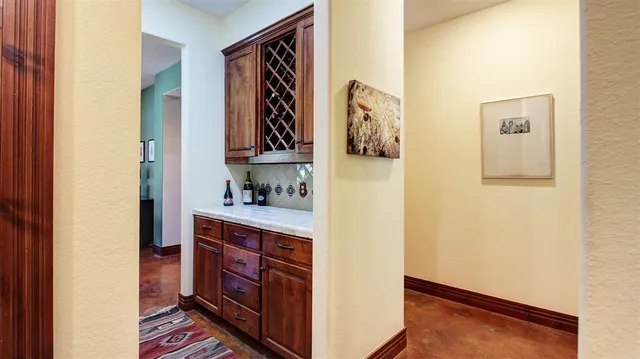 a kitchen with stainless steel appliances granite countertop a refrigerator and a stove
