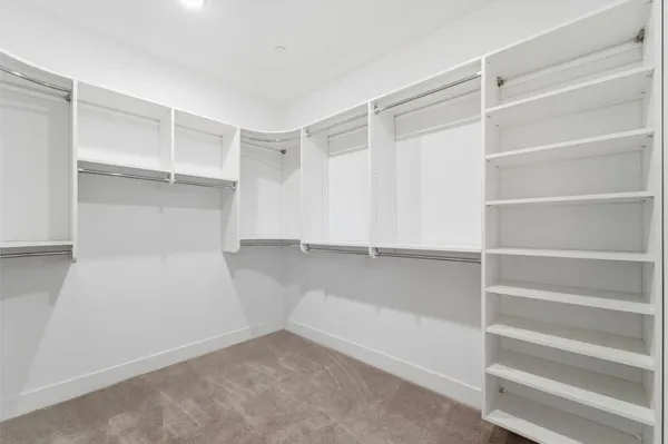 a view of an empty walk in closet