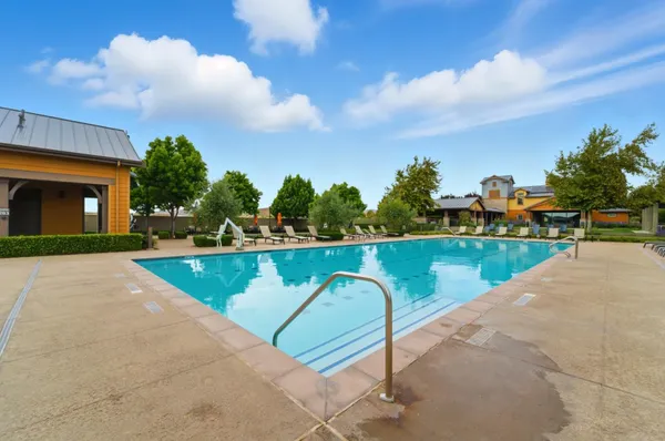 a view of swimming pool with a yard
