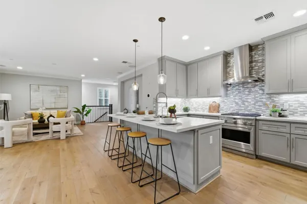a large kitchen with lots of counter space a sink and appliances