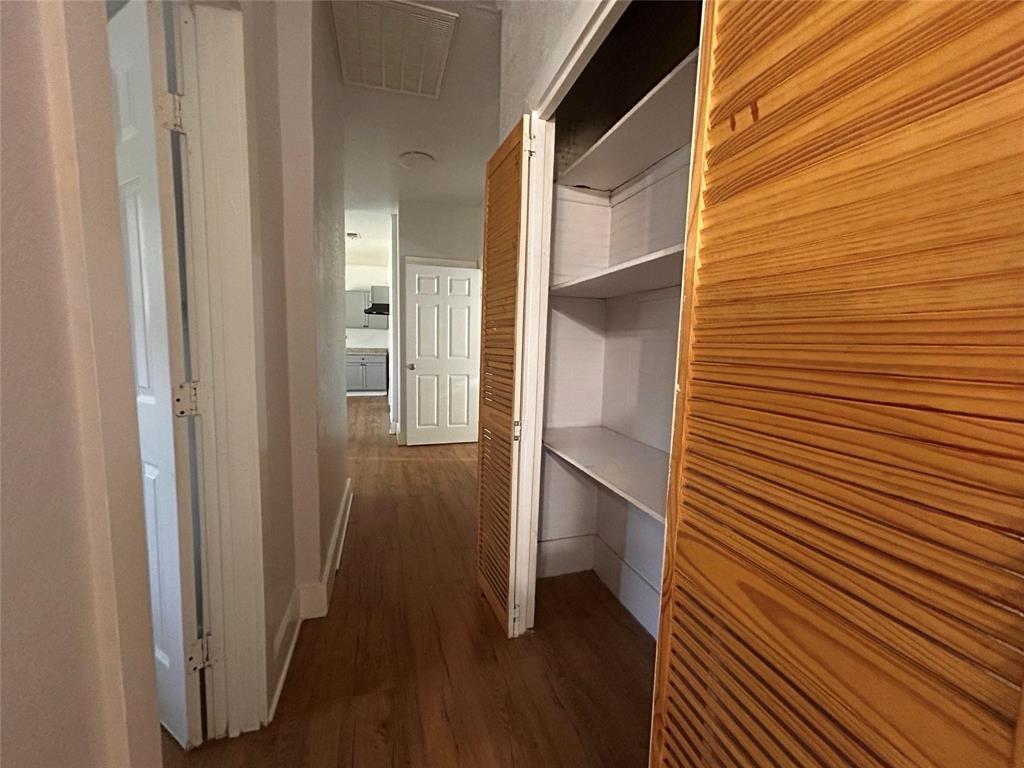 3615 Meadow Street Dallas, TX 75215 - Photo 15 of 15 Corridor with dark wood finished floors