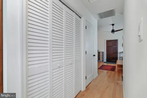 a view of a hallway with a white walls