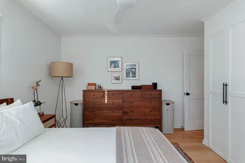 a bed room with a bed and a lamp