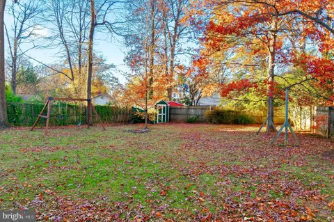a view of street with large trees