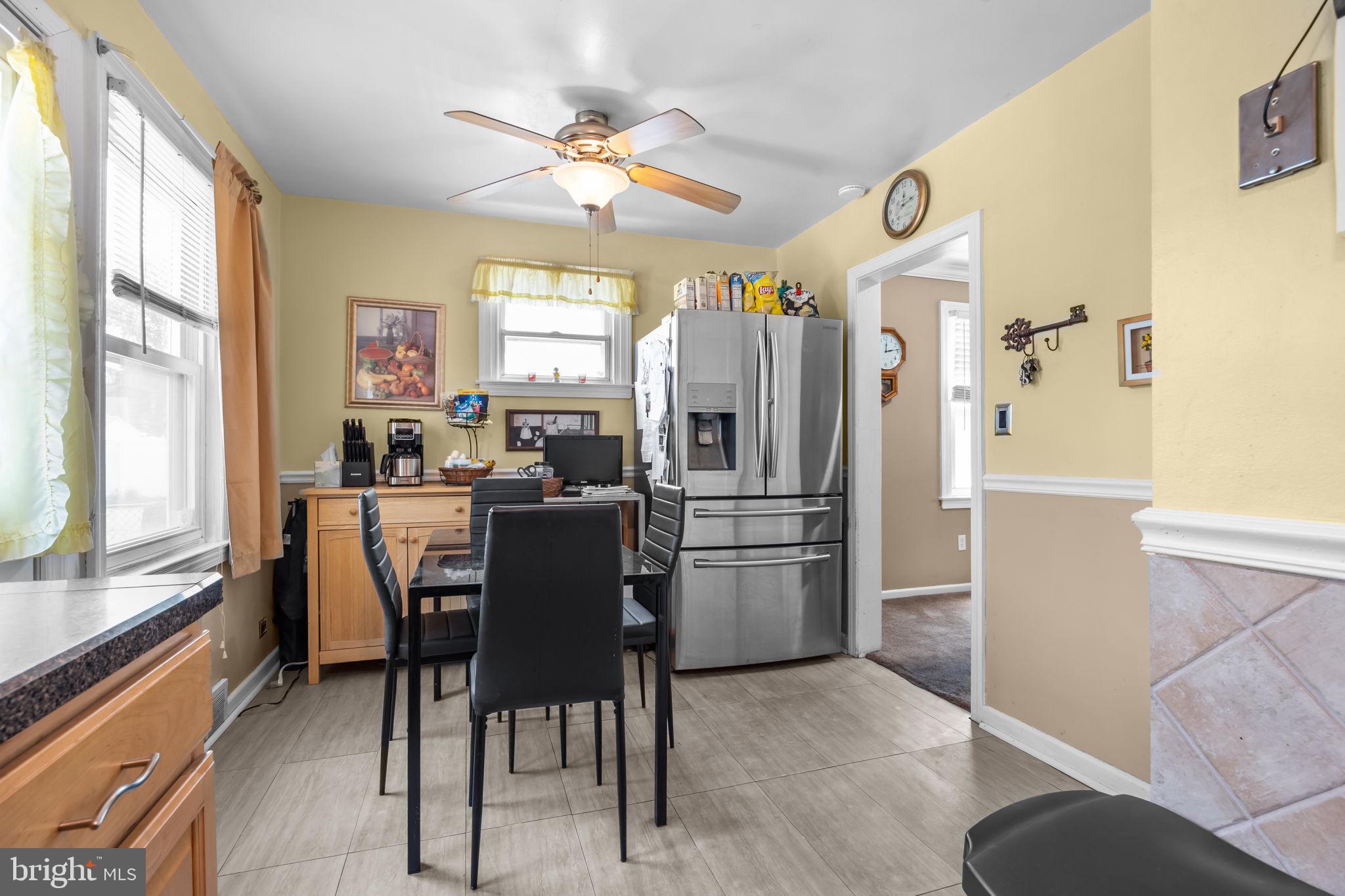 16 James Road Hatboro, PA 19040 - Photo 14 of 22 a kitchen with stainless steel appliances kitchen island granite countertop a refrigerator a stove a microwave oven with a dining table and chairs