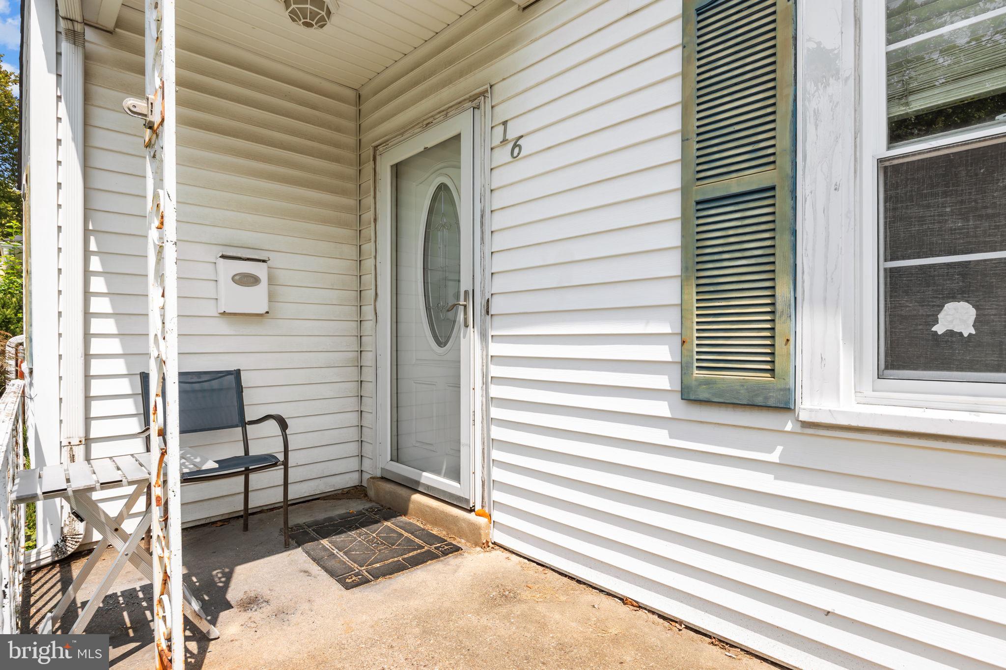 16 James Road Hatboro, PA 19040 - Photo 3 of 22 a view of a porch with a bench and floor to ceiling window