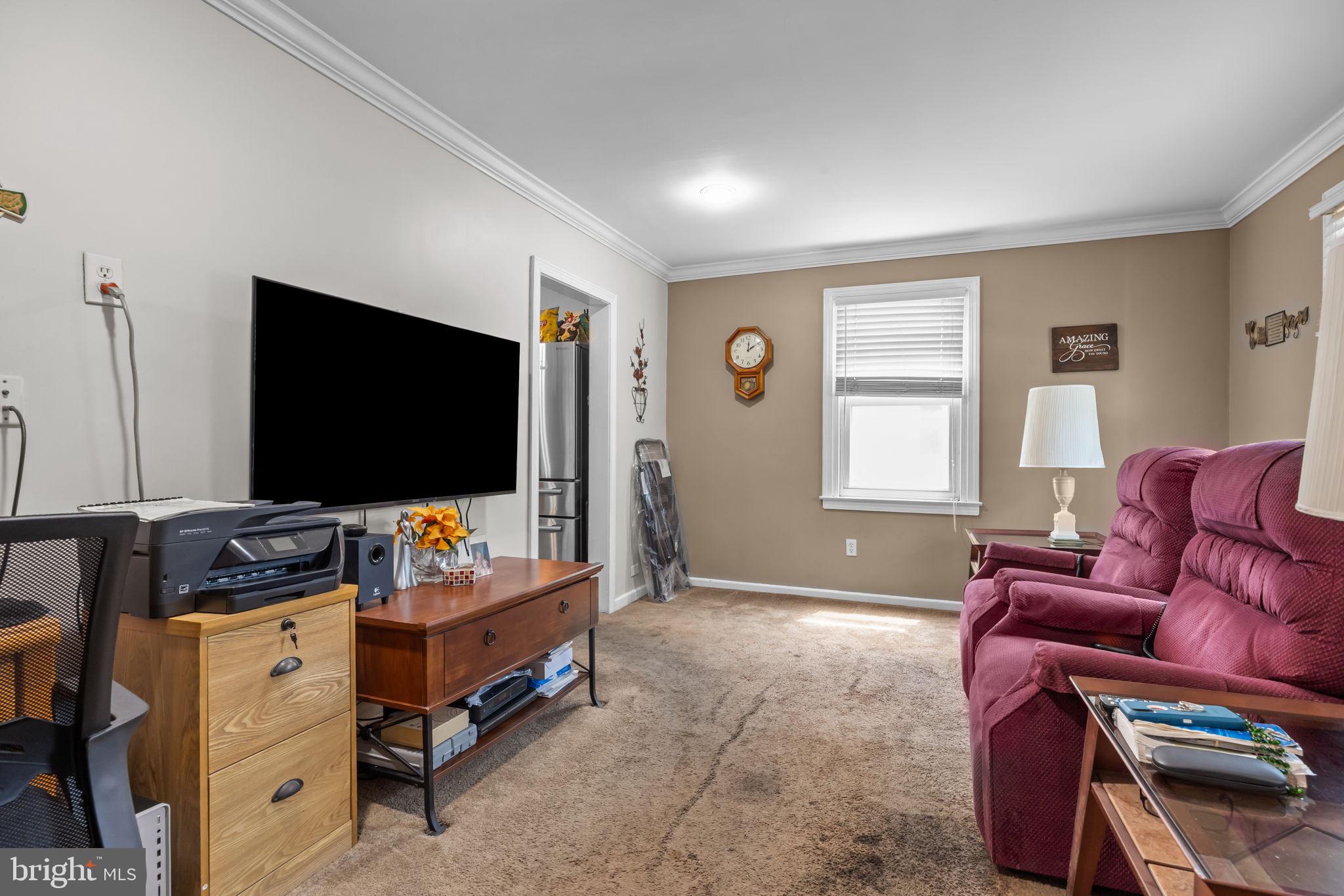 16 James Road Hatboro, PA 19040 - Photo 4 of 22 a living room with furniture and a flat screen tv