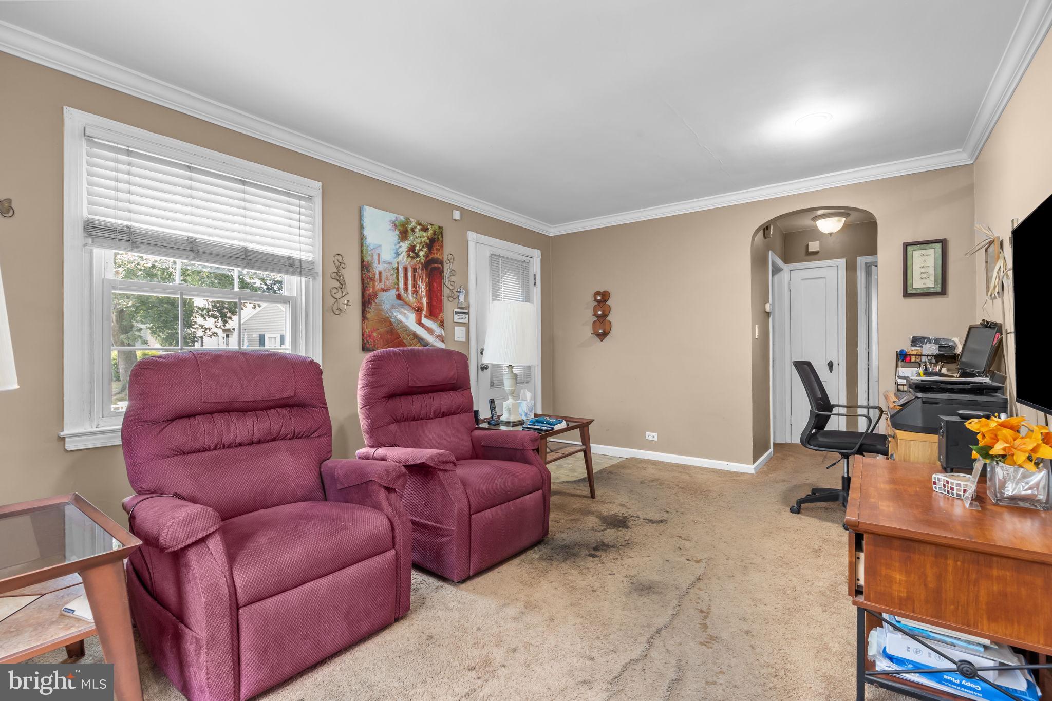 16 James Road Hatboro, PA 19040 - Photo 6 of 22 a living room with furniture fireplace and a large window