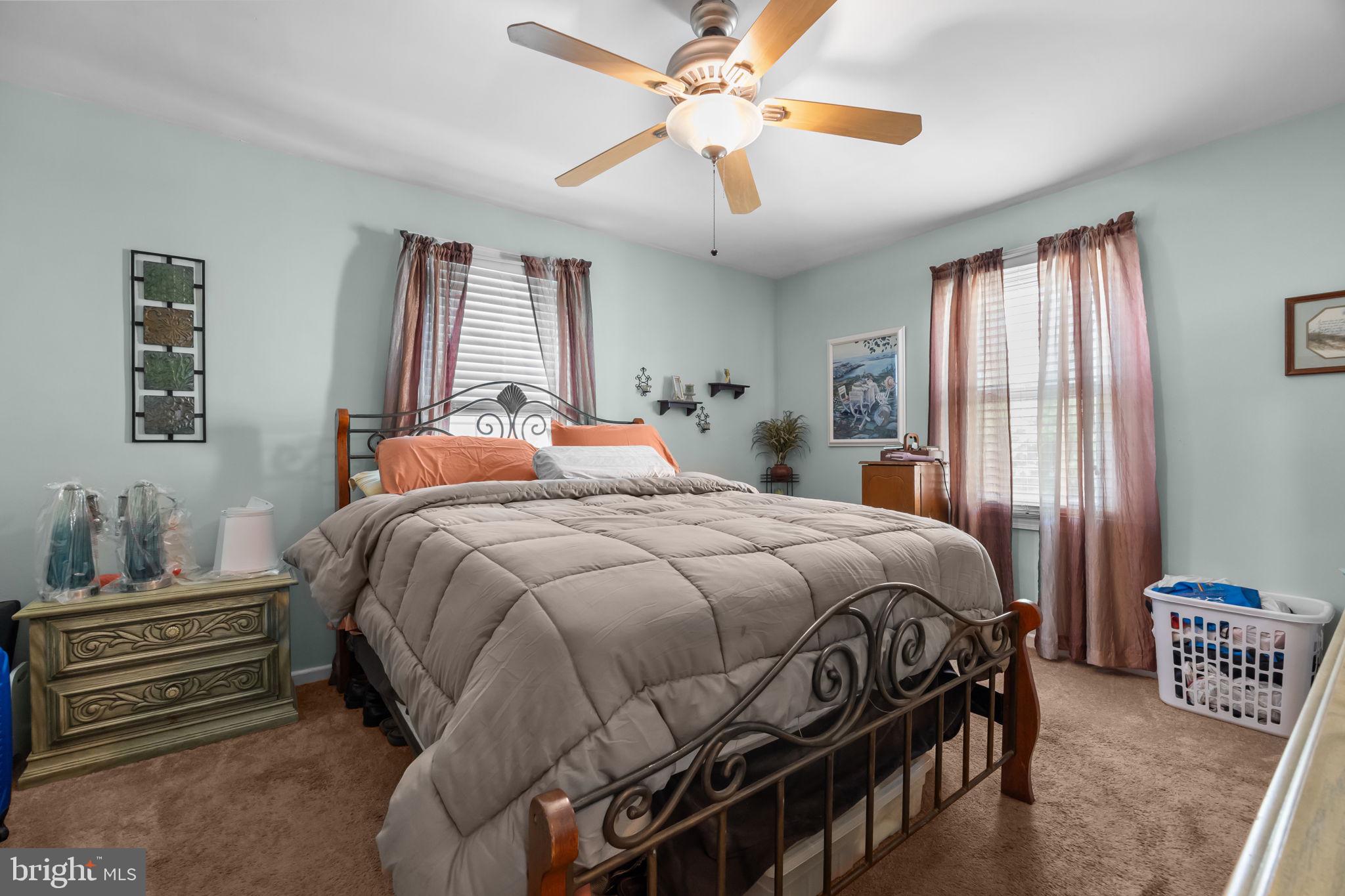 16 James Road Hatboro, PA 19040 - Photo 9 of 22 a bedroom with a bed and a chandelier