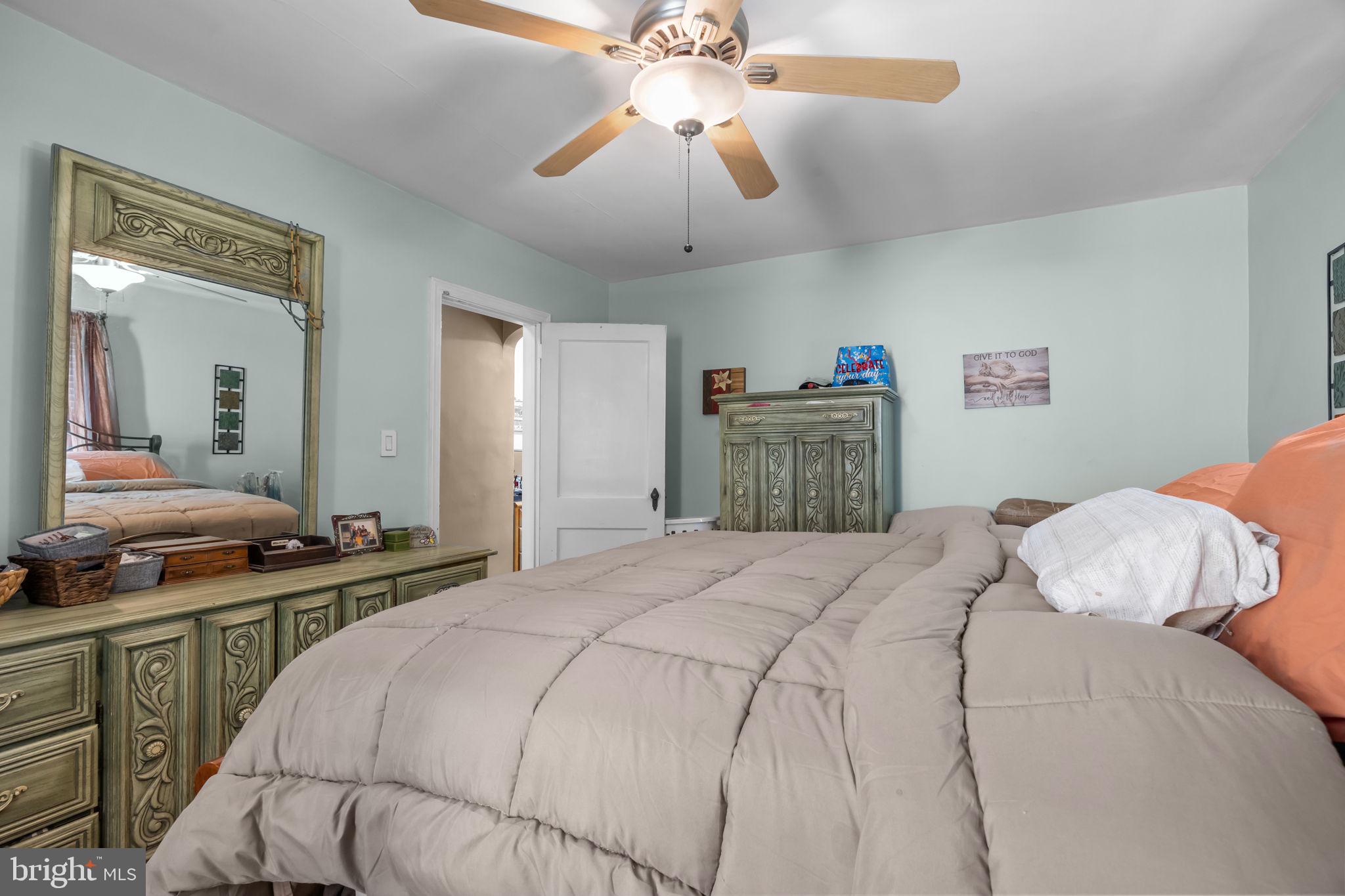 16 James Road Hatboro, PA 19040 - Photo 10 of 22 a bedroom with a bed and a chandelier