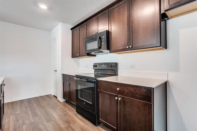a kitchen with a sink and a microwave