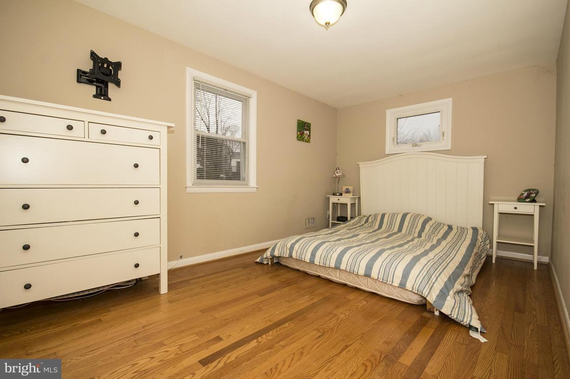 8216 Edwill Avenue Rosedale, MD 21237 - Photo 14 of 27 a bedroom with a bed and a dresser