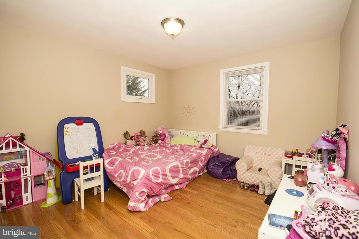 8216 Edwill Avenue Rosedale, MD 21237 - Photo 16 of 27 a bedroom with bed and window