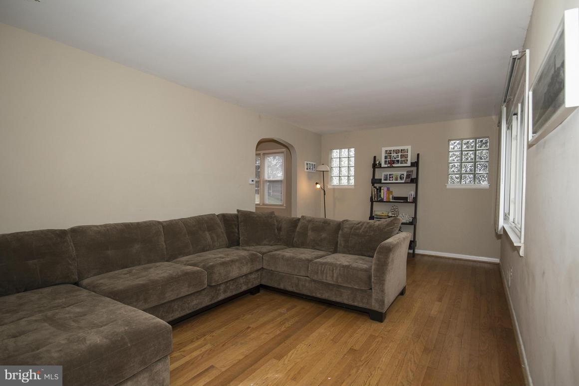 8216 Edwill Avenue Rosedale, MD 21237 - Photo 3 of 27 a living room with furniture and a wooden floor