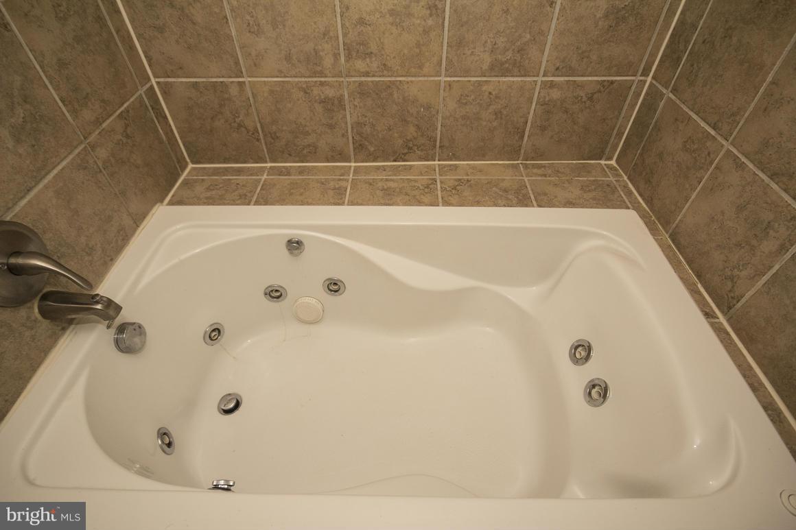 8216 Edwill Avenue Rosedale, MD 21237 - Photo 23 of 27 a bathroom with a bathtub