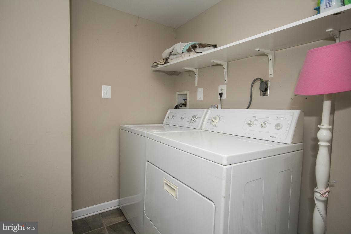 8216 Edwill Avenue Rosedale, MD 21237 - Photo 25 of 27 a utility room with dryer and washer