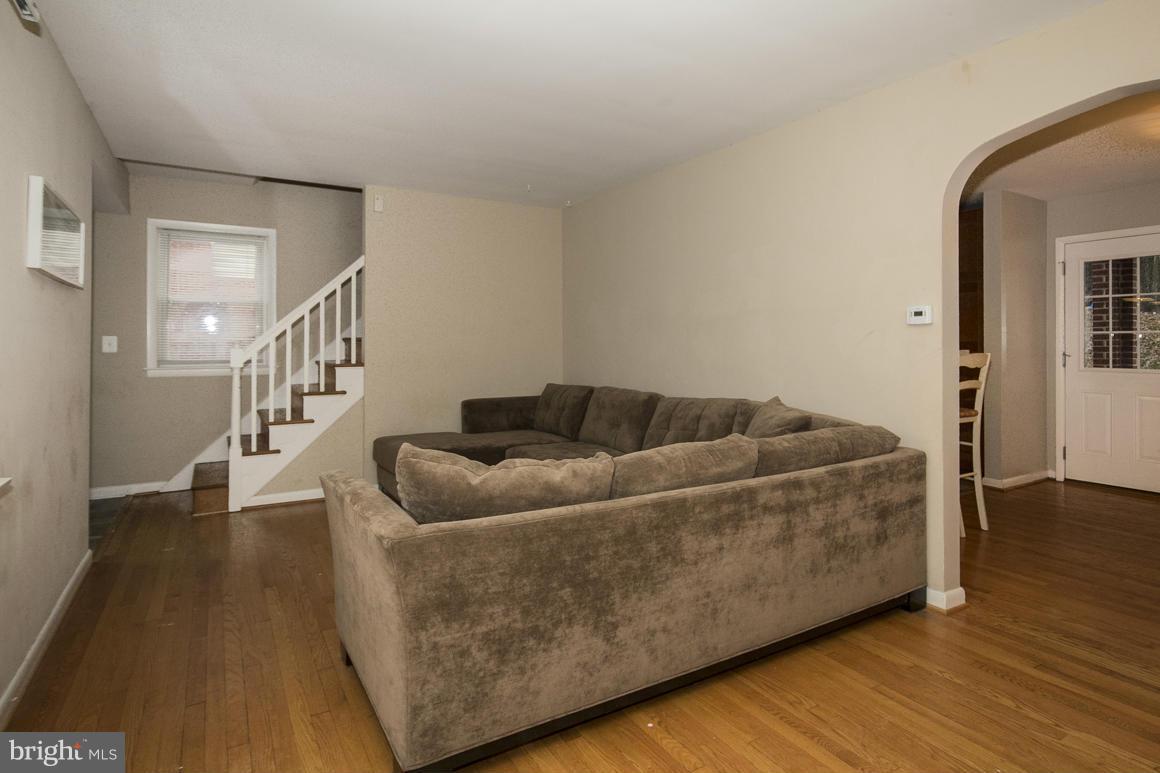 8216 Edwill Avenue Rosedale, MD 21237 - Photo 5 of 27 a living room with furniture and wooden floor