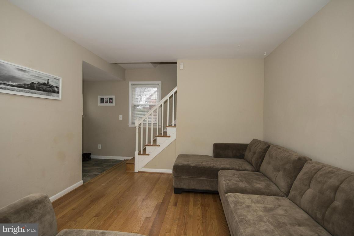 8216 Edwill Avenue Rosedale, MD 21237 - Photo 6 of 27 a living room with furniture and a wooden floor
