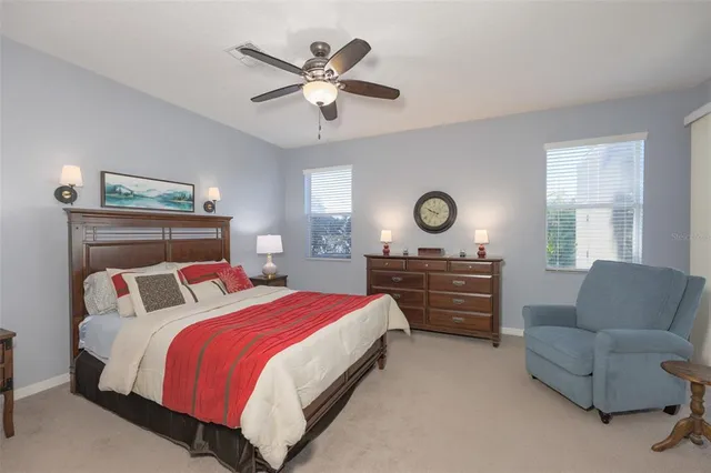 a bedroom with a bed and a couch