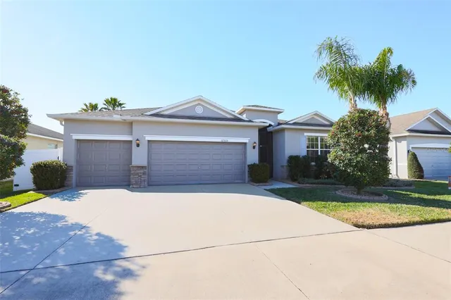 an aerial view of a house with garden space and street view