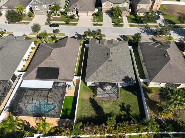 an aerial view of a house with outdoor space swimming pool and outdoor seating