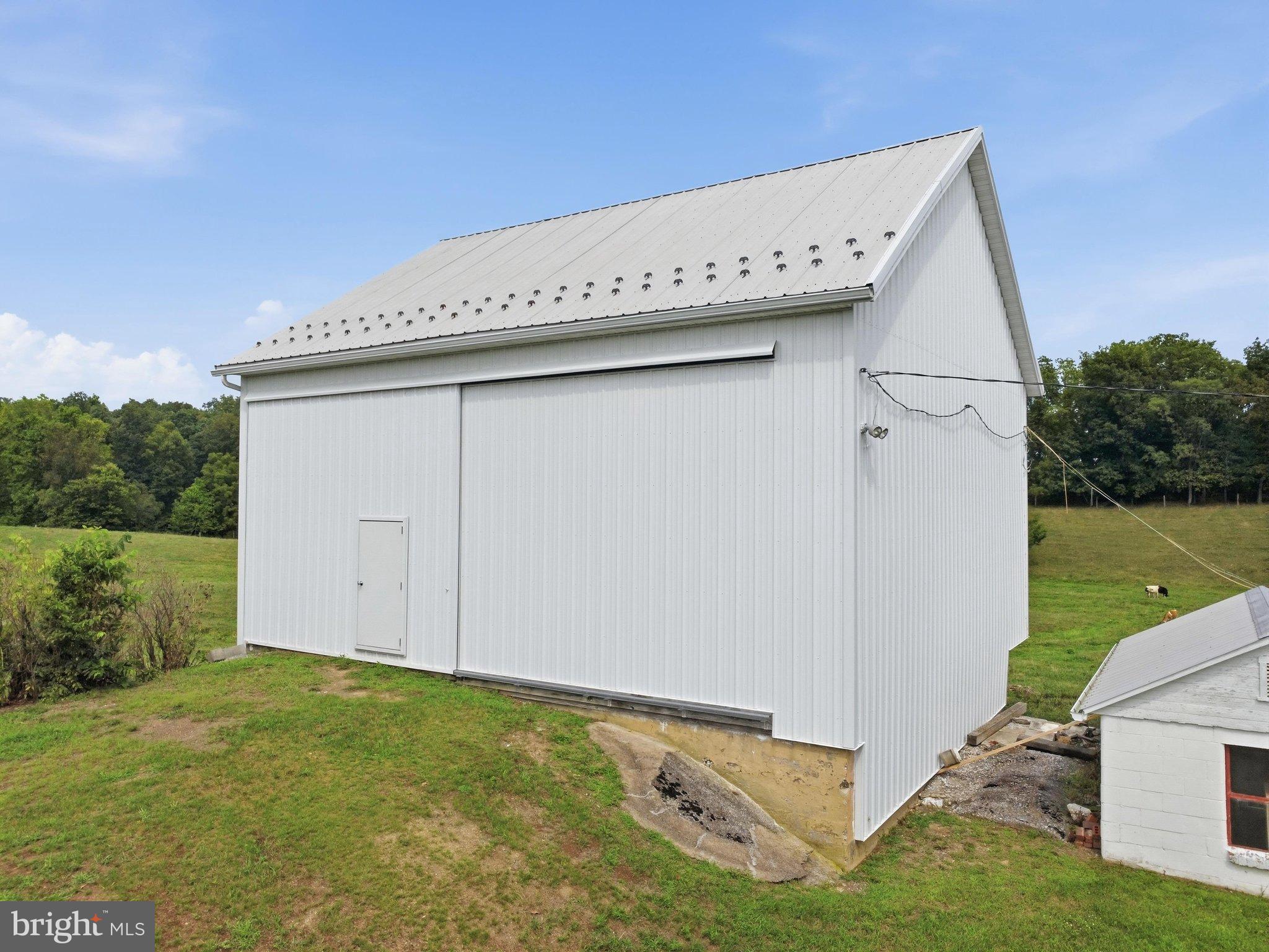 697 Shinham Road Greencastle, PA 17225 - Photo 9 of 23 Beautiful bank barn with metal siding and roof!