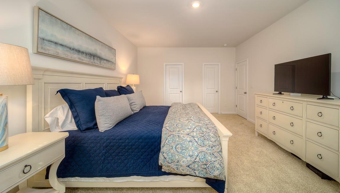 1208 Secrest Cmns Drive Monroe, NC 28112 - Photo 19 of 40 a living room with furniture and a flat screen tv