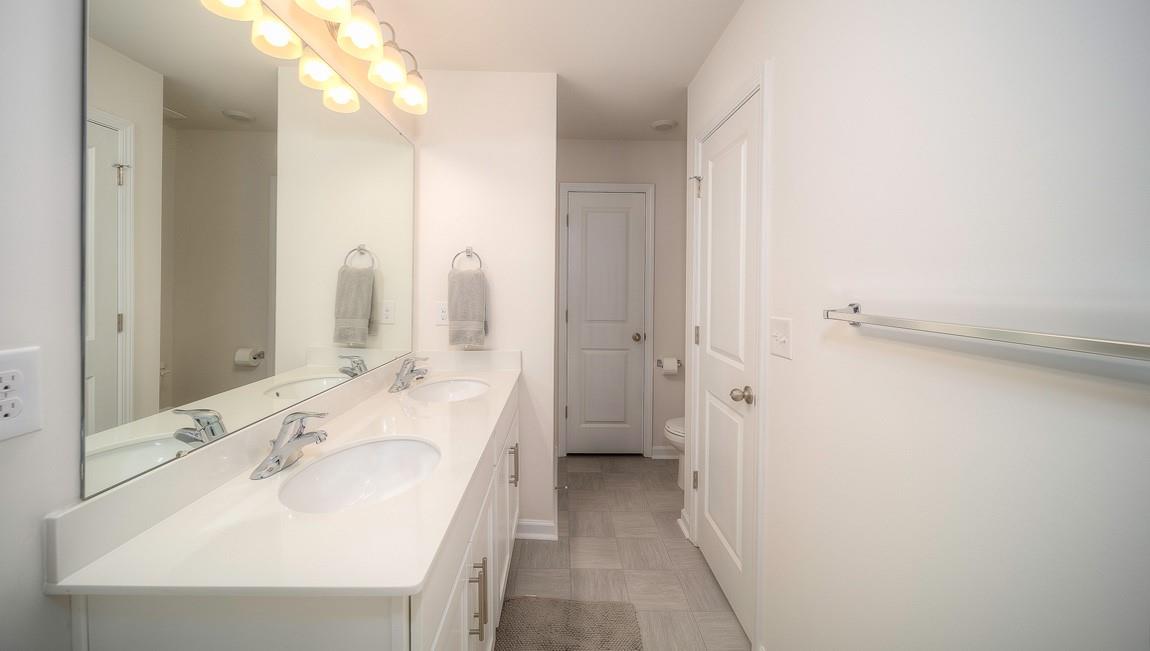 1208 Secrest Cmns Drive Monroe, NC 28112 - Photo 30 of 40 a bathroom with a sink and a mirror
