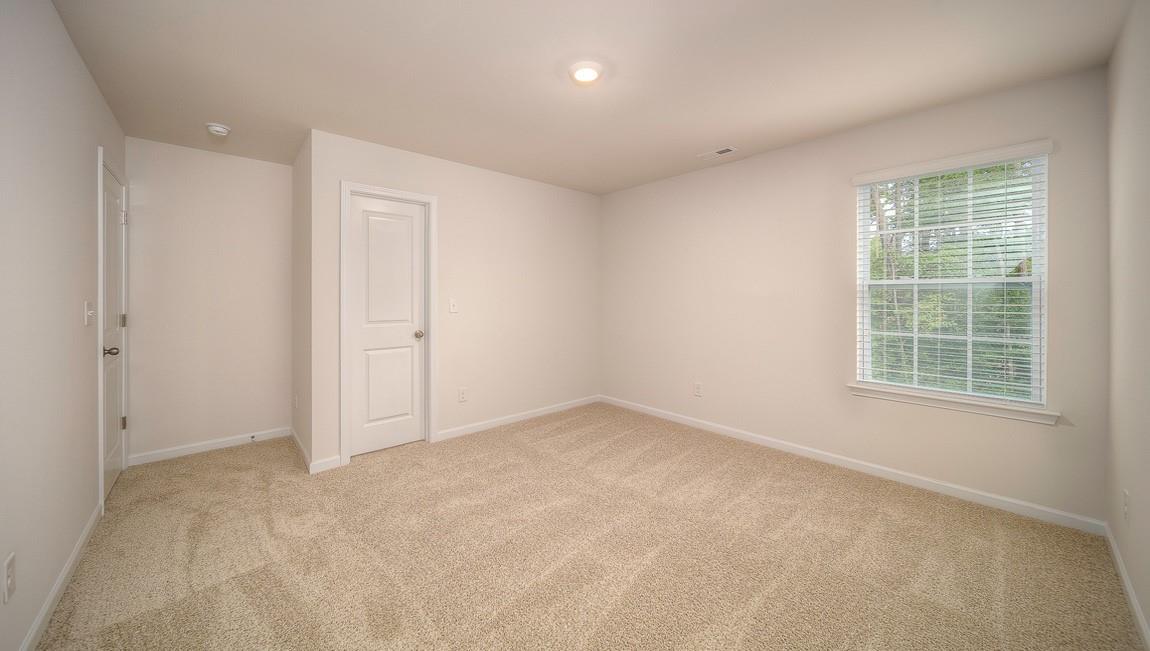 1208 Secrest Cmns Drive Monroe, NC 28112 - Photo 32 of 40 an empty room with windows