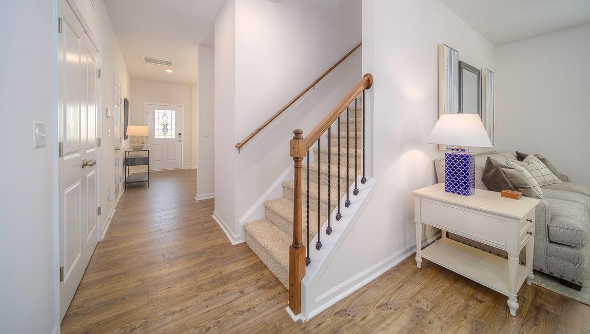 1208 Secrest Cmns Drive Monroe, NC 28112 - Photo 6 of 40 a view of a hallway with wooden floor and stairs