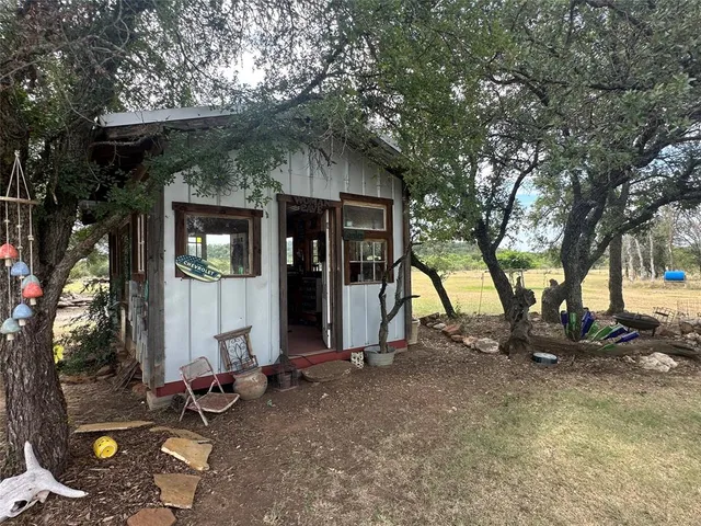 a view of a forest with a yard