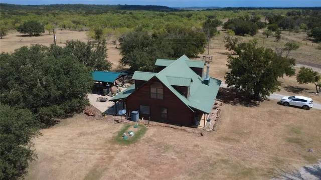 a living room filled with furniture and a chandelier