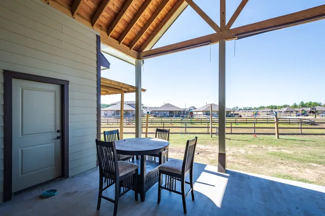 a view of a swimming pool with outdoor seating