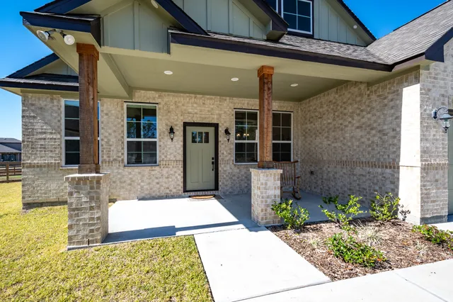 a front view of a house with a rug
