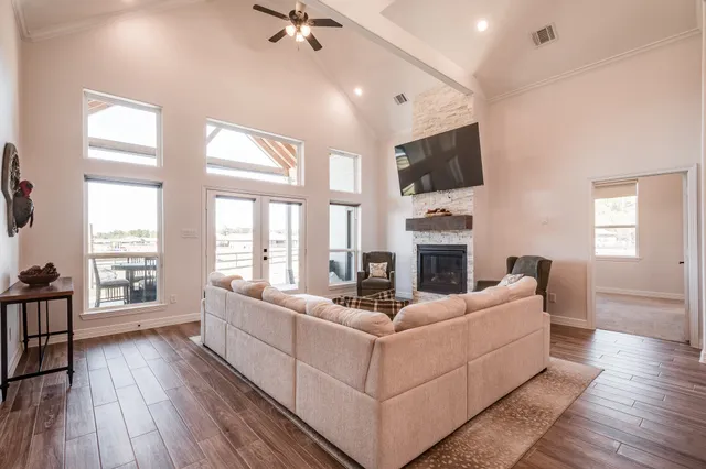 a living room with furniture fireplace and flat screen tv
