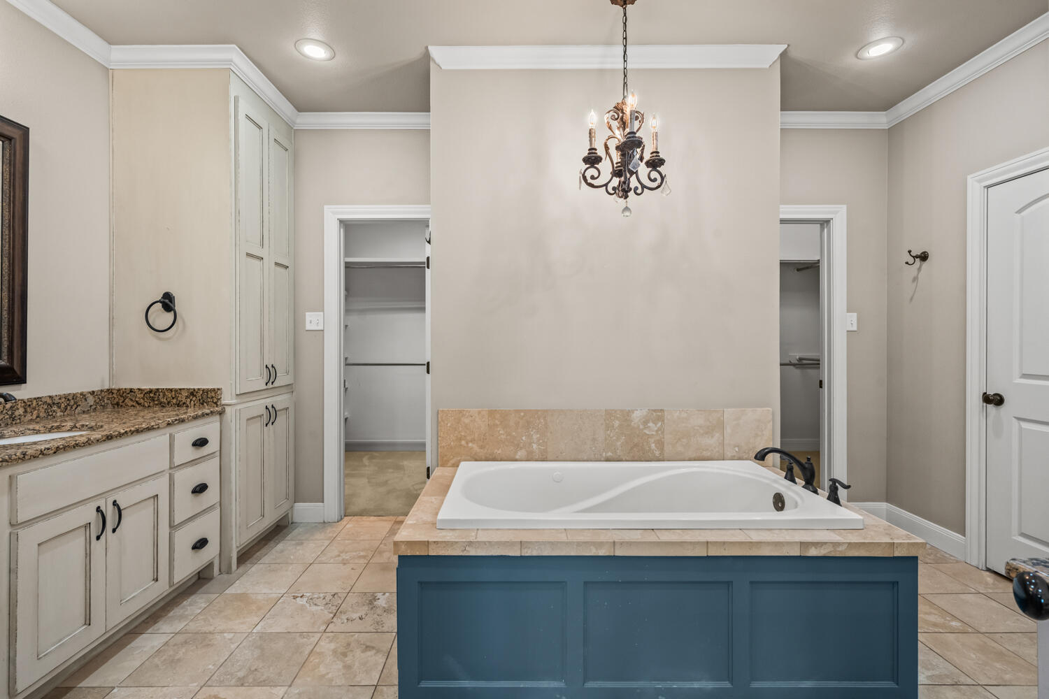 1405 11th Place Shallowater, TX 79363 - Photo 28 of 81 a bathroom with a tub sink and mirror
