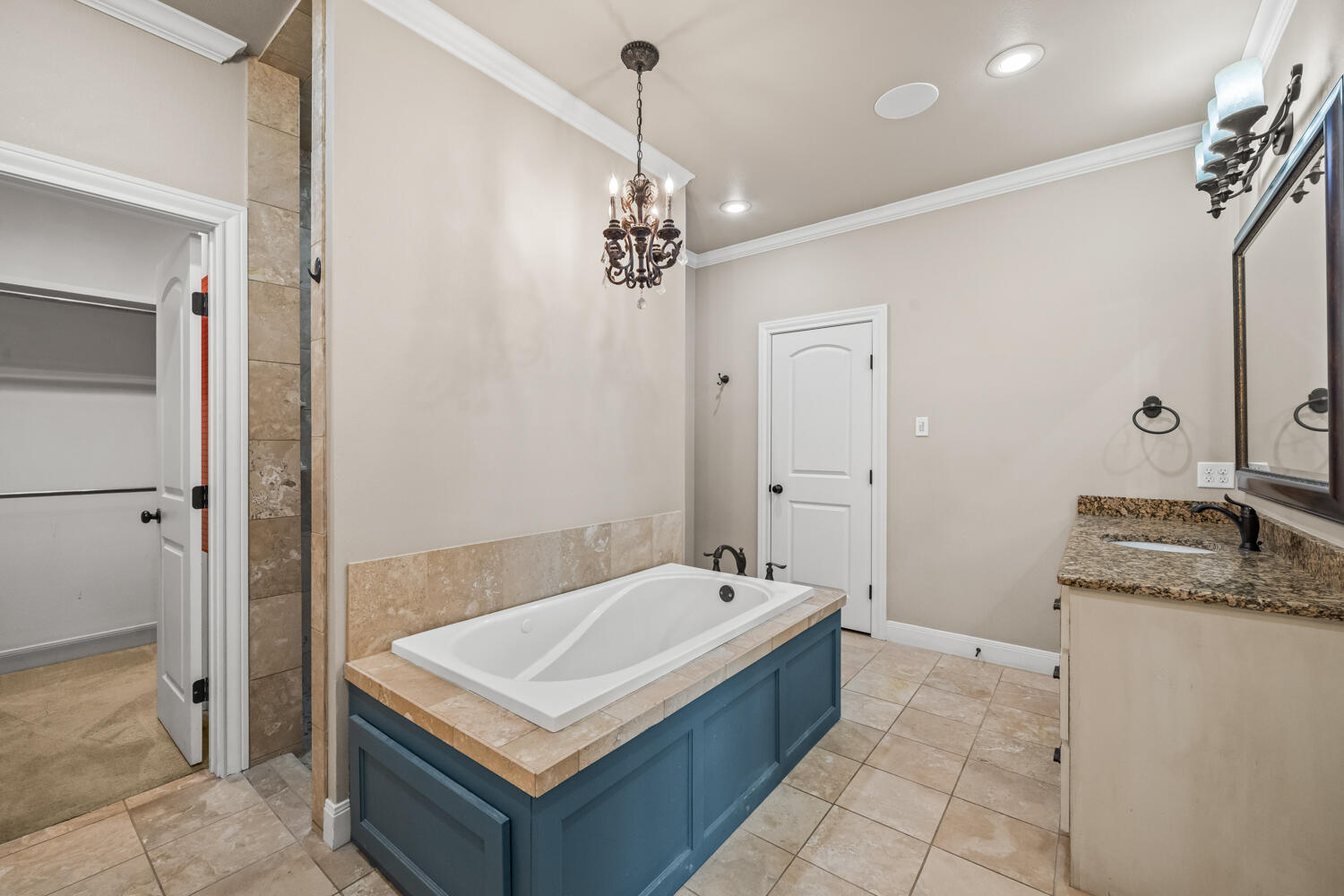 1405 11th Place Shallowater, TX 79363 - Photo 29 of 81 a bathroom with a tub sink and mirror