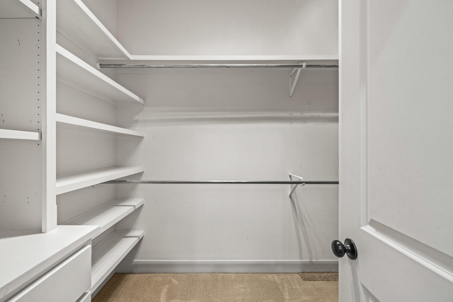 1405 11th Place Shallowater, TX 79363 - Photo 37 of 81 a view of walk in closet with empty racks