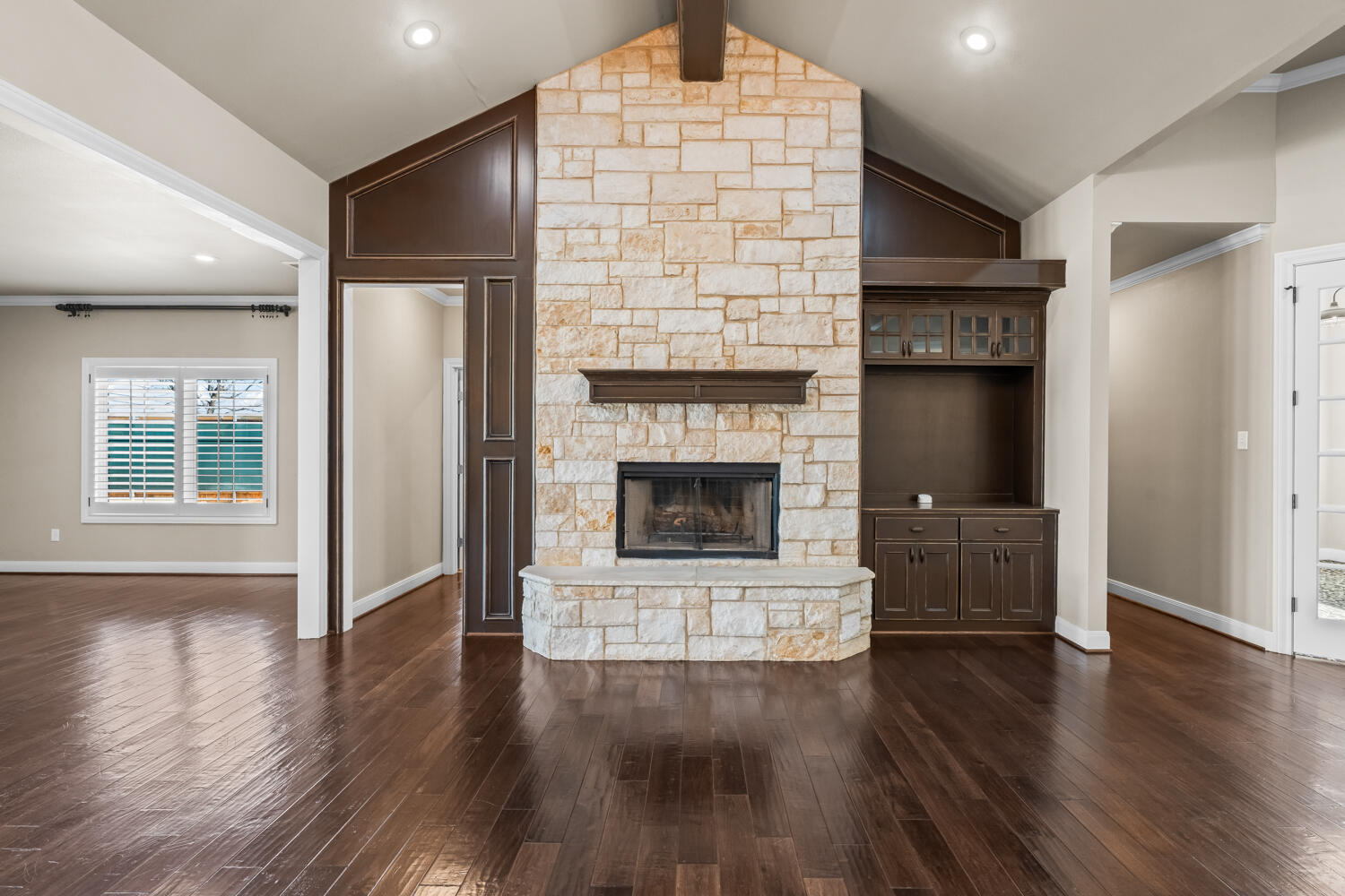 1405 11th Place Shallowater, TX 79363 - Photo 4 of 81 an empty room with wooden floor and fireplace