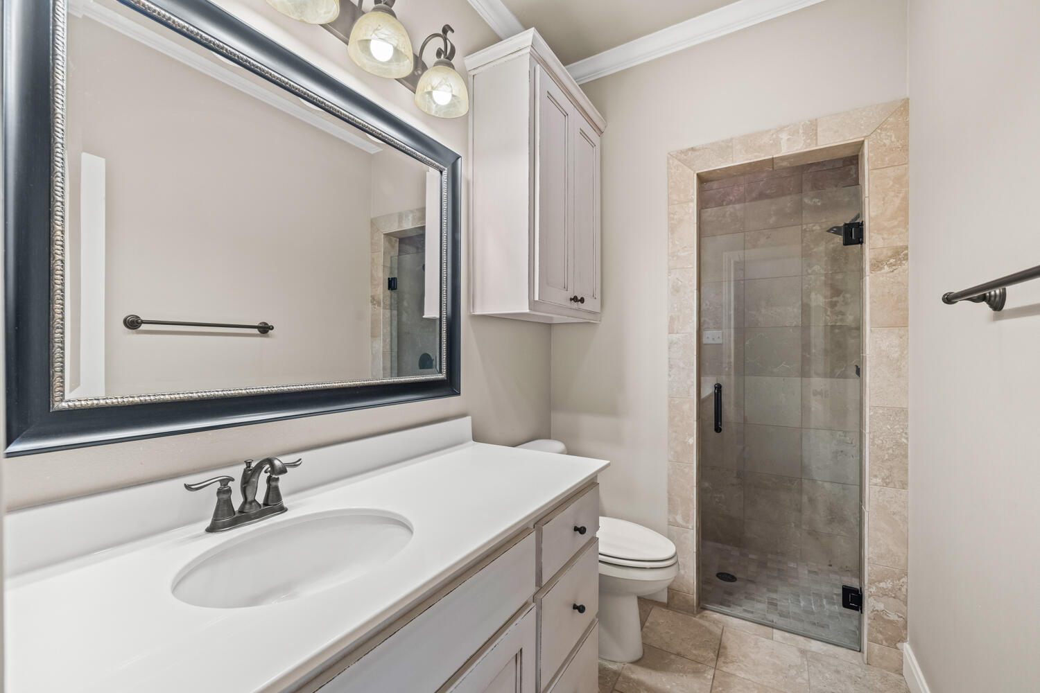 1405 11th Place Shallowater, TX 79363 - Photo 41 of 81 a bathroom with a sink a toilet and shower