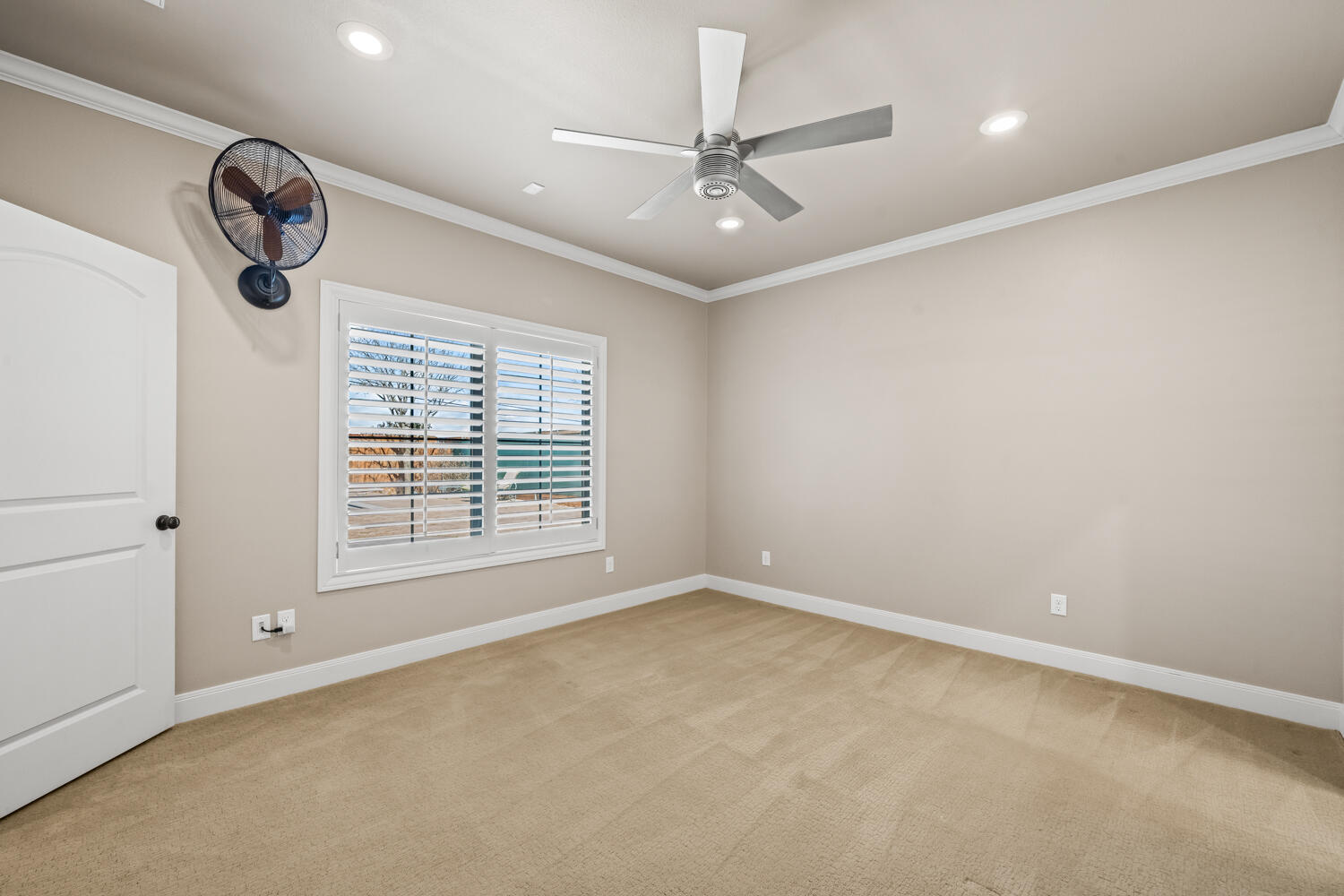 1405 11th Place Shallowater, TX 79363 - Photo 49 of 81 an empty room with a fan & a large window