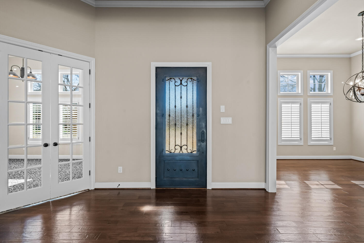 1405 11th Place Shallowater, TX 79363 - Photo 5 of 81 an empty room with wooden floor and windows