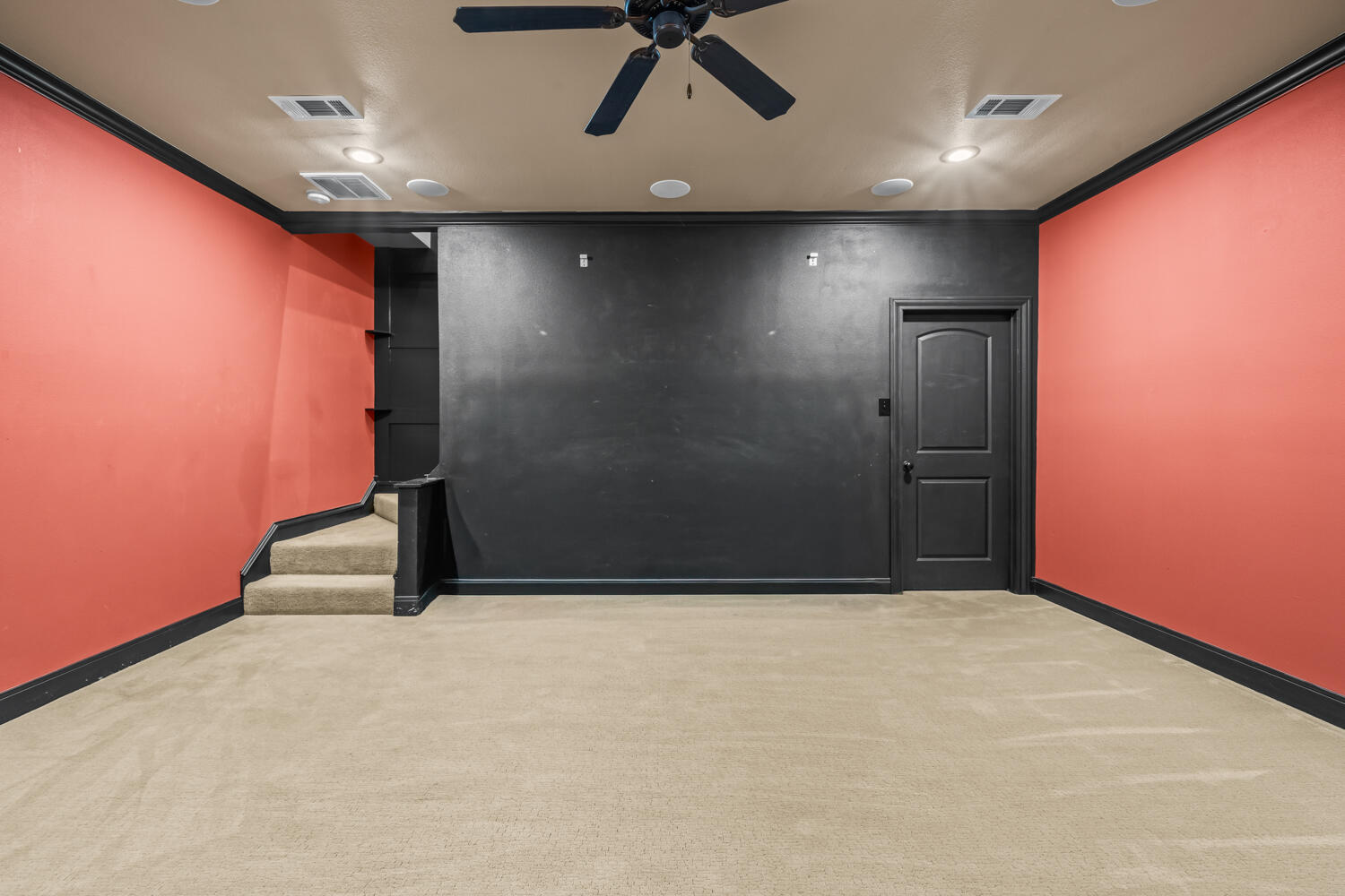 1405 11th Place Shallowater, TX 79363 - Photo 56 of 81 an empty room with a ceiling fan and carpet