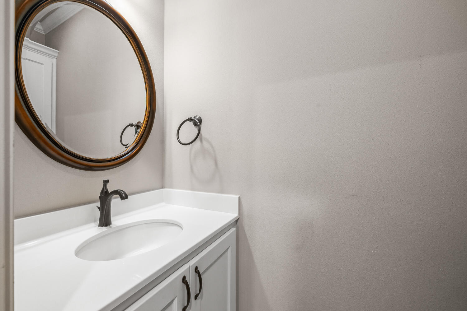 1405 11th Place Shallowater, TX 79363 - Photo 58 of 81 a bathroom with a sink and a mirror