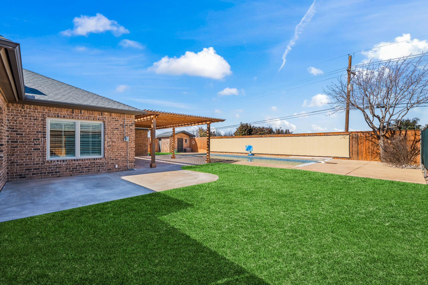 1405 11th Place Shallowater, TX 79363 - Photo 64 of 81 a view of a patio with a table and chairs
