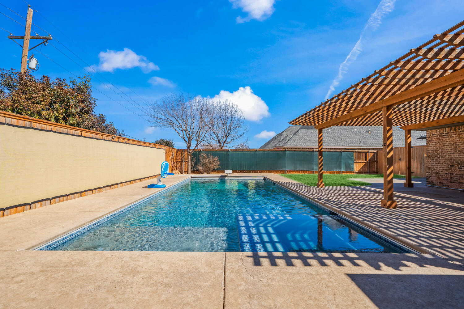 1405 11th Place Shallowater, TX 79363 - Photo 69 of 81 a view of a swimming pool with a patio