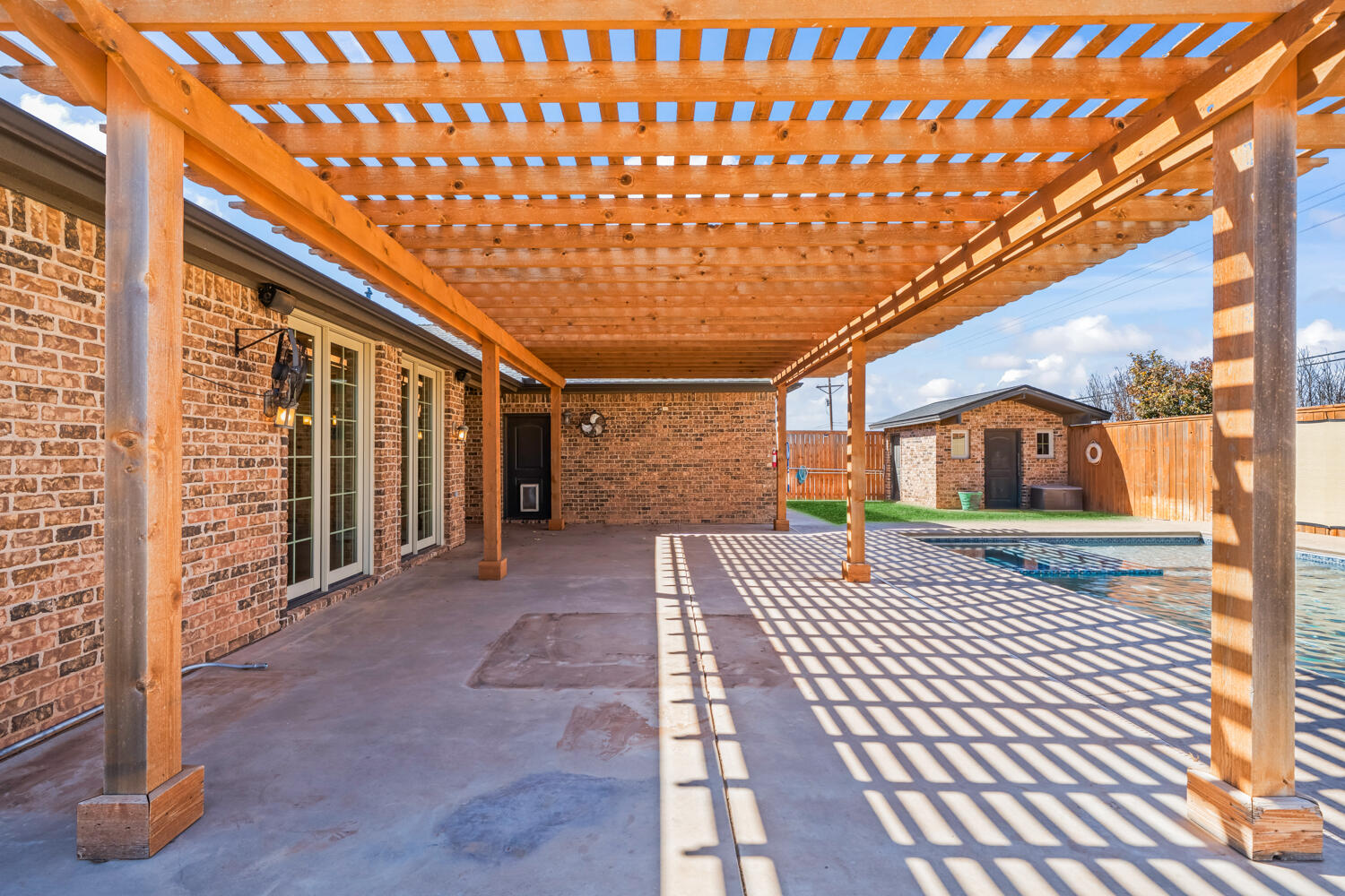1405 11th Place Shallowater, TX 79363 - Photo 70 of 81 a view of a porch with wooden floor