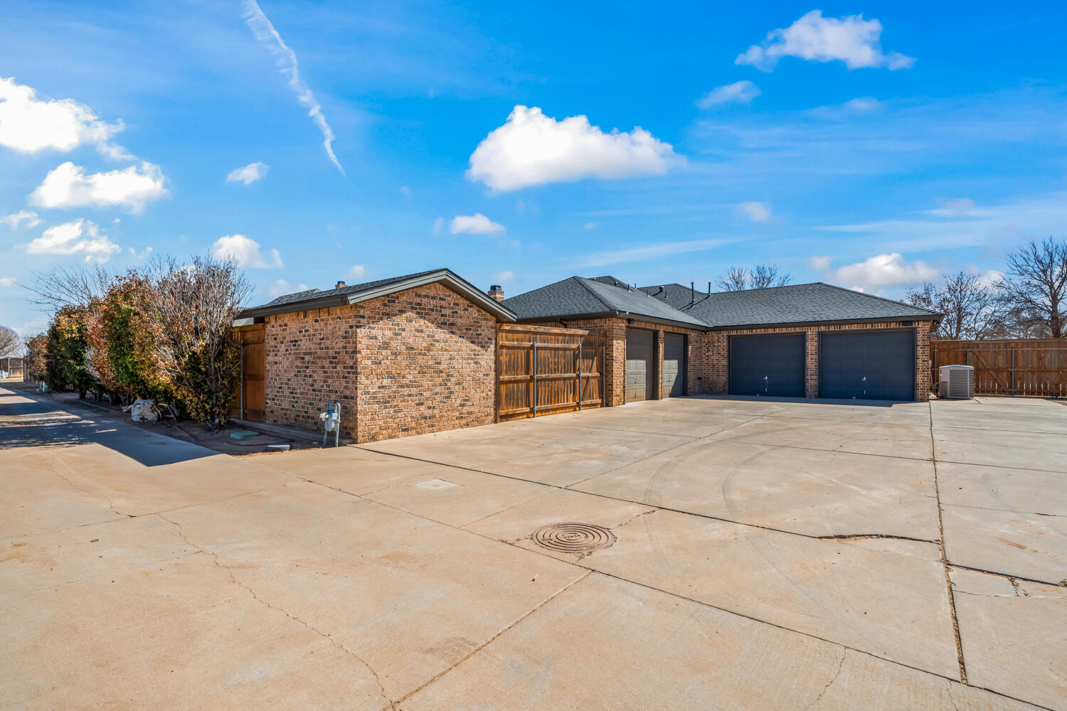 1405 11th Place Shallowater, TX 79363 - Photo 78 of 81 a front view of a house with a yard and garage